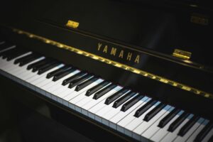 Close-up of a Yamaha piano showing black and white keys, perfect for music enthusiasts.